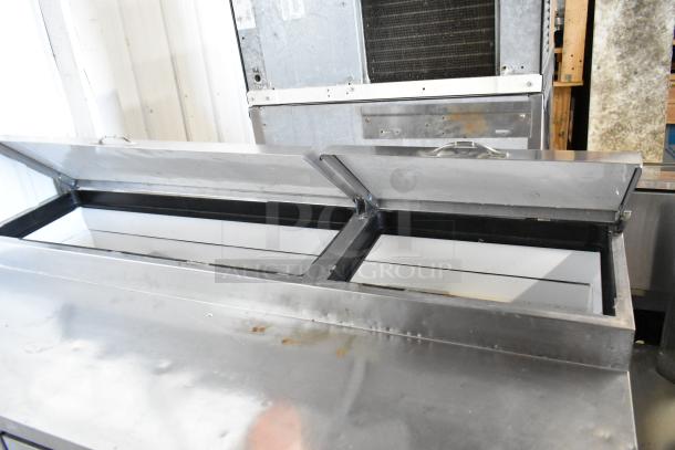 True TPP-67D-2 stainless steel pizza prep table with door, two drawers, and hinged top. 115 volts, 1 phase, commercial use.