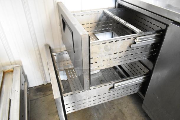 True TPP-67D-2 stainless steel commercial pizza prep table with door and two drawers, 115 volts, 1 phase, open drawers visible.