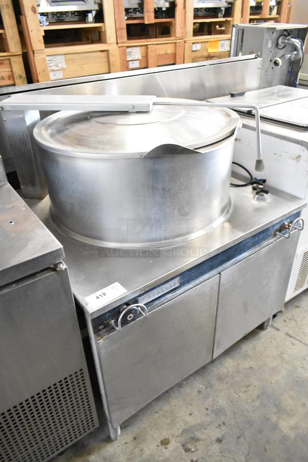 Garland KT40S-M stainless steel 40-gallon steam kettle, floor model. Features sturdy build, control valve, and lid. Model label visible.