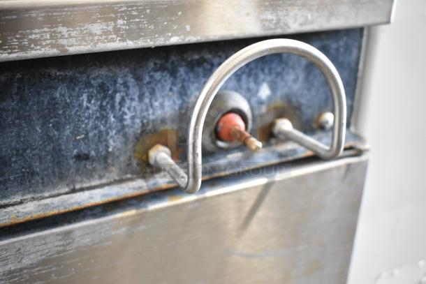 Garland KT40S-M 40 Gallon Steam Kettle, stainless steel, shows control valve detail, industrial wear visible.