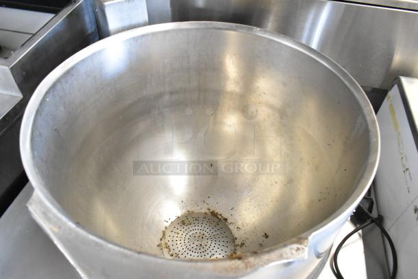 Garland KT40S-M stainless steel 40-gallon steam kettle, floor style, used condition, visible wear on interior.