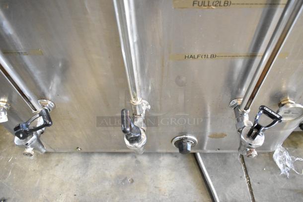 Cecilware FE-200 stainless steel commercial coffee urn, 120/208 volts, with dual spigots and capacity markings.