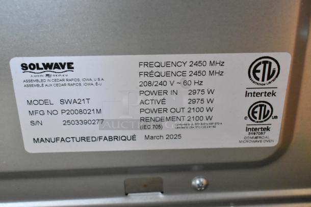 BRAND NEW SCRATCH AND DENT 2025 Solwave SWA21T Microwave, stainless steel, 208/240V, with label showing specs and certifications.