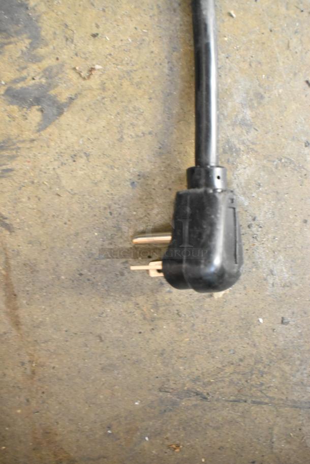 Close-up of a black electrical plug for Solwave SWA21T microwave. 208/240 volts, 1 phase. Brand new, scratch-and-dent condition.