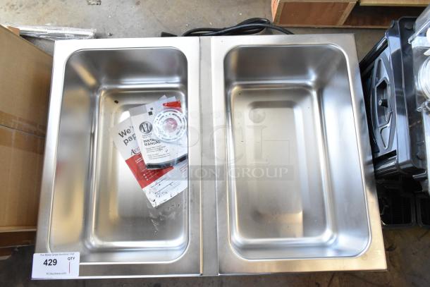 Brand new Avantco 177FW200D dual well electric countertop food warmer with thermostatic controls. Some minor dents visible.