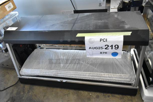 Brand new Vollrath FMA7048 48" hot food merchandiser, 120V, 1 phase. Light surface scratches, unit wrapped.
