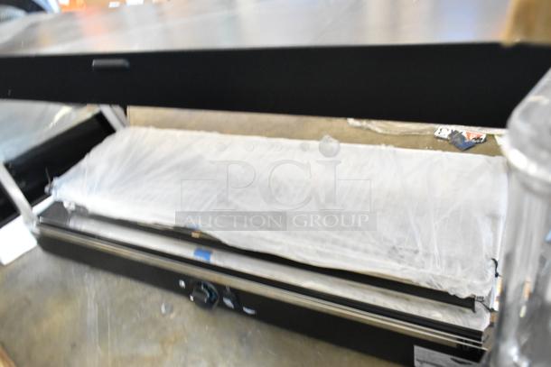 Brand new, scratch and dent Vollrath FMA7048 48" hot food merchandiser, 120V, 1 phase, wrapped in protective covering.