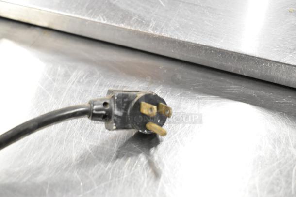 True TSSU-48-12 prep table power plug, stainless steel surface. 115 volts, 1 phase, commercial use.