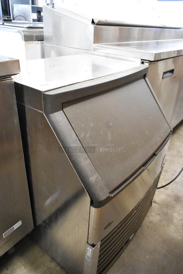 Manitowoc QY0214A stainless steel undercounter ice machine, 115V, self-contained, minor surface wear, model label visible.