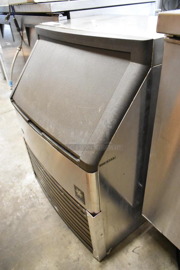 Manitowoc QY0214A stainless steel undercounter ice machine, 115V, 1 phase, self-contained, showing minor wear.