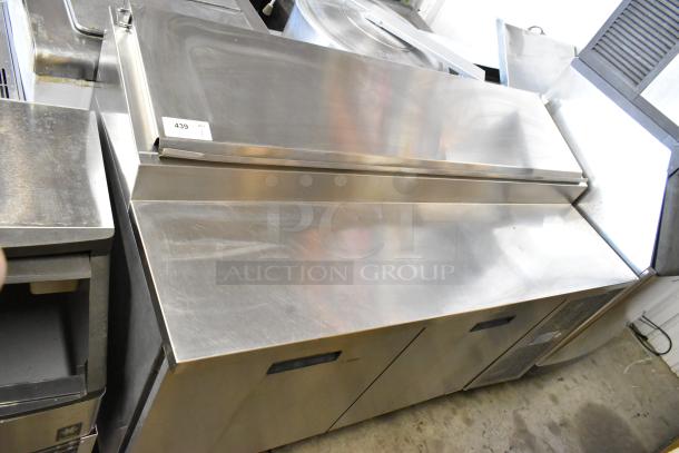 Randell 8268N stainless steel commercial pizza prep table on casters, 115V, 1-phase, with visible surface wear.