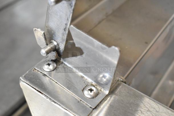 Randell 8268N stainless steel pizza prep table detail, showing hinge and screws, highlighting sturdy construction and condition.