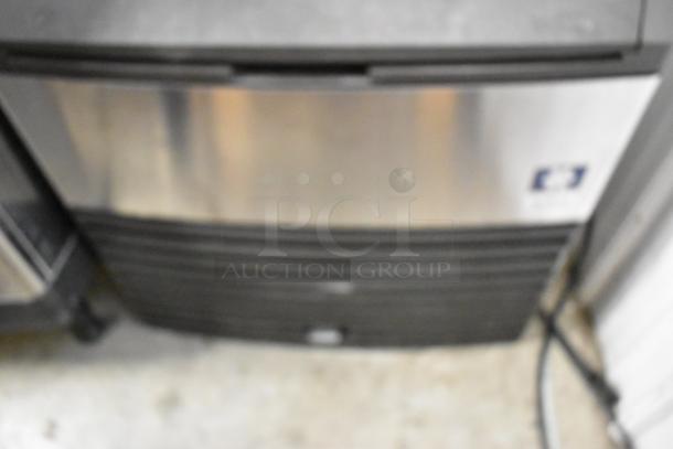 Manitowoc QY0214A stainless steel ice machine, 115 volts, 1 phase, commercial use. Self-contained, durable build.