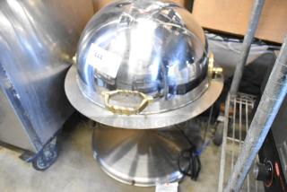 Round metal chafing dish with a polished dome lid, gold-tone handle, and visible label number 444. Appears in good condition.