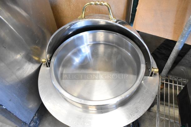 Stainless steel round chafing dish with gold tone handle, excellent condition; perfect for serving at events.