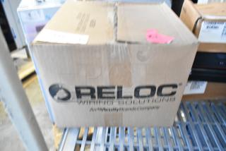 Brand new Reloc OFC 277 12/2G OnePass Fixture Cable in sealed box, visible branding and label, unblemished condition.