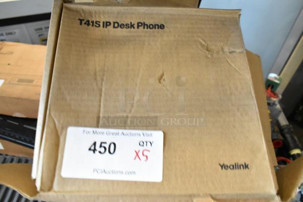 Five brand new Verizon T41S IP Desk Phones in original boxes. Boxes show minor wear; labeled Yealink. Auction lot number 450, quantity 5.