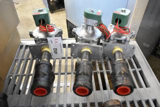 Three brand new Asco 323632 rebuild kits on a metal rack, with visible auction tag and model details.