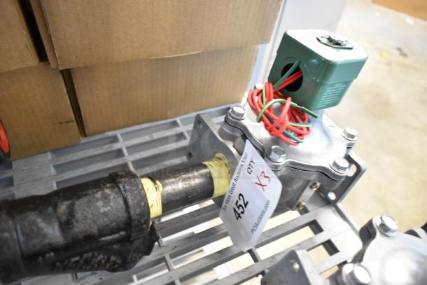 3 brand new Asco 323632 rebuild kits on a shelf. Labels show auction info: "Lot 452, QTY X3."