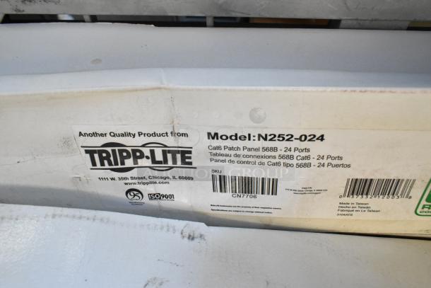 BRAND NEW Tripp Lite Cat6 Patch Panel, model N252-024, 568B, 24 ports, box label indicating ISO 9001 certification. Made in Taiwan.