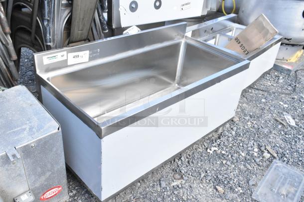 Brand new Regency 600IB1836 18"x36" underbar ice bin, 119 lb capacity, no legs, visible NSF and Regency labels.