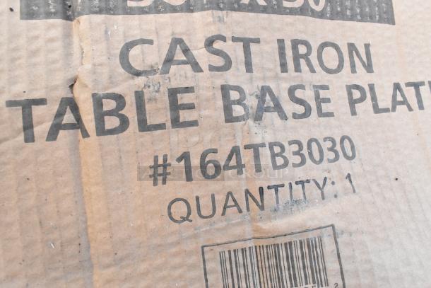 Cardboard box labeled "Cast Iron Table Base Plate #164TB3030, Quantity: 1," featuring a barcode.