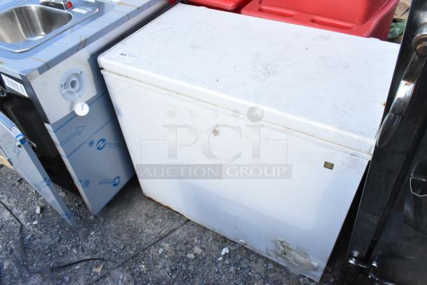 General Electric GE FCM75UBWW chest freezer, 115V, 1 Phase. White exterior with visible wear and marks. Used condition.