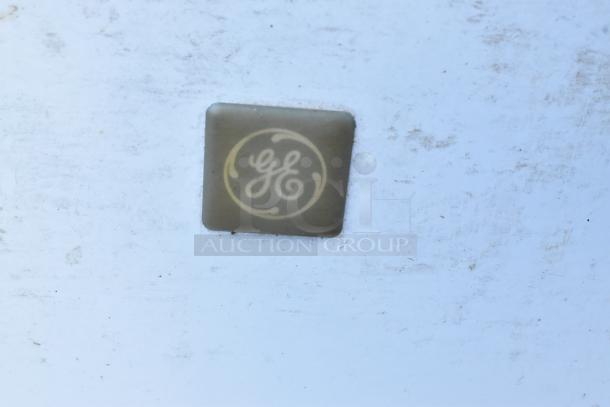 General Electric GE FCM75UBWW chest freezer, white, 115 volts, 1 phase, with GE logo on front.