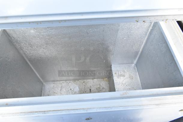General Electric GE FCM75UBWW chest freezer, clean interior view, 115 volts, 1 phase, showing slight wear.
