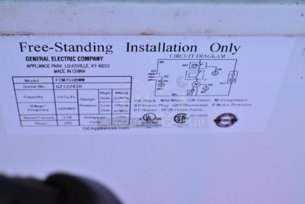 GE FCM75UBWW chest freezer label showing model, serial number, voltage (115V), and capacity (7.0 cu. ft.), made in China.