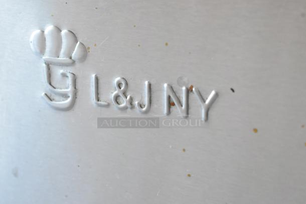Close-up of L&J NY logo embossed on stainless steel commercial steam table surface.