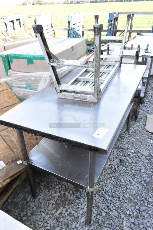 Stainless steel table with under shelf, moderate wear. Perfect for commercial kitchens. Auction tag "417" visible.