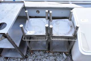 Two stainless steel rice cooker equipment stands on commercial casters, noted as durable and functional. Signs of wear visible.