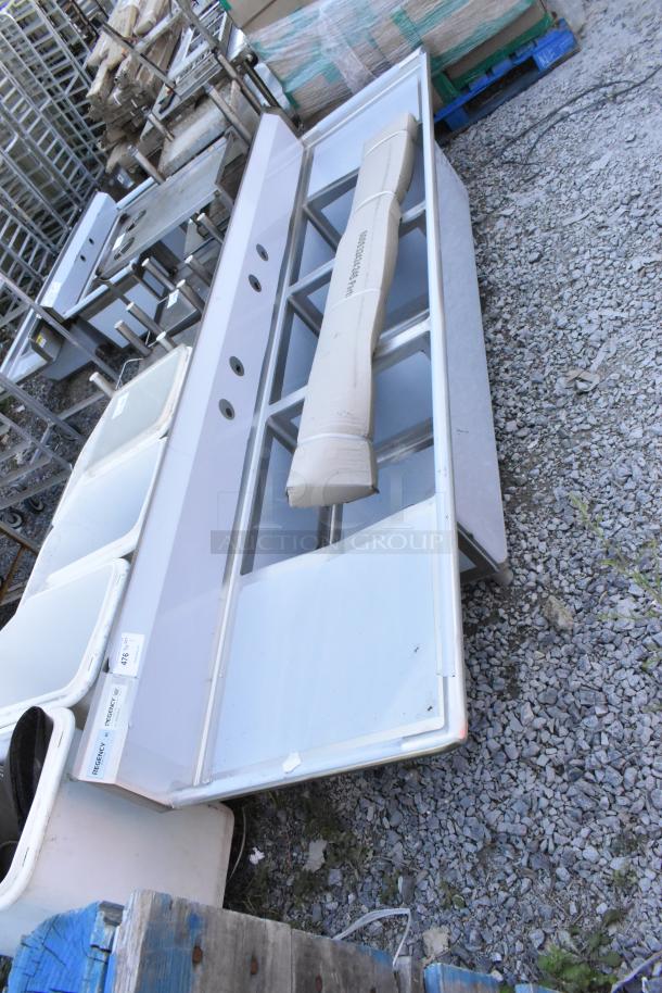 Brand new Regency 600S3242424S stainless steel 3 bay sink with dual drainboards, scratch and dent condition.