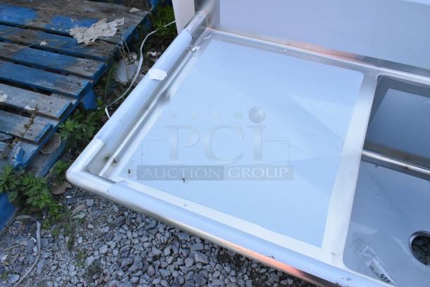 Regency 600S3242424S stainless steel 3 bay sink, dual drainboards, scratch and dent condition, new.