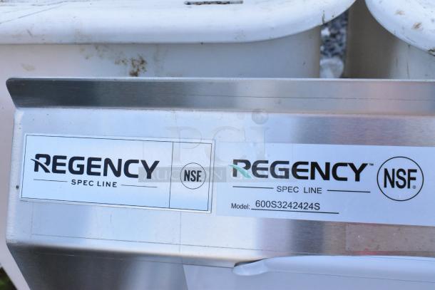 Regency 600S3242424S stainless steel sink label, indicates model and NSF approval. Scratches visible, but new condition.