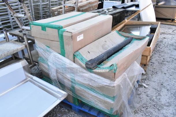 12 brand new boxes containing Quantum 1836P wire shelves on pallet. Boxes sealed, marked "BRAND NEW."