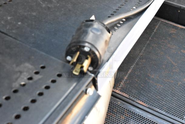 Killion Metal Commercial Merchandiser, 208/230V, 1 Phase, features detailed, showing plug and perforated metal surface.