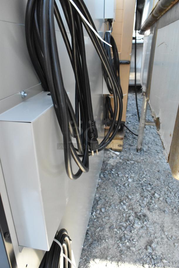 Brand new scratch and dent shelving unit with metal construction, visible black cables, and minor surface imperfections.