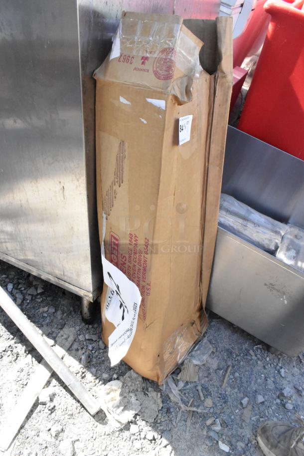 Brand new Blodgett HP33294 burner assembly in damaged packaging, visible dents, and scratches on the box.
