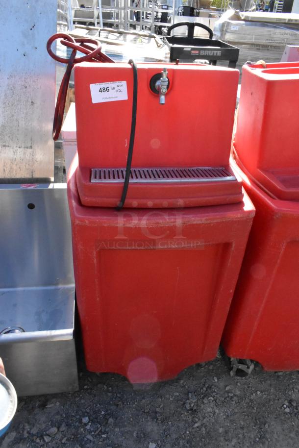 Red poly single tap dispensing system, commercial casters, auction tag "486," good condition, durable construction.
