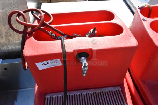 2 red poly single tap dispensing systems on commercial casters, with hoses and taps. Auction label 486 visible.