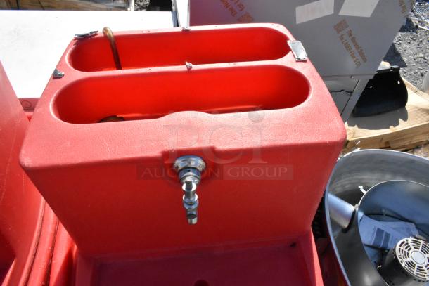 2 Red Poly Single Tap Dispensing Systems on commercial casters, sturdy design, single taps visible, good condition.