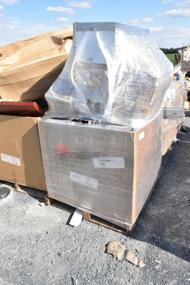Pallet of 18 brand new scratch and dent items wrapped in plastic, includes various appliances and boxes, ready for auction.