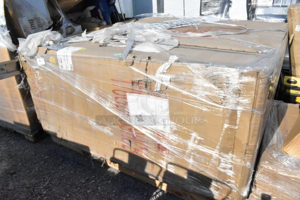Cardboard box containing a BRAND NEW SCRATCH AND DENT 2024 Avantco glass door merchandiser fridge, wrapped in plastic with visible markings.