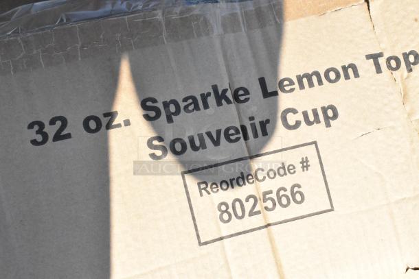 Cardboard box labeled "32 oz. Sparke Lemon Top Souvenir Cup," with reorder code #802566. Box condition appears intact.