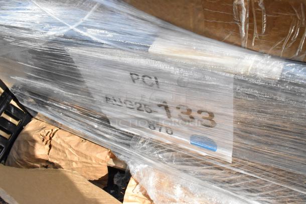 Shrink-wrapped package with visible label reading "AUC25-133." Includes Winco pancake dispenser and food warmer. New, scratch and dent.