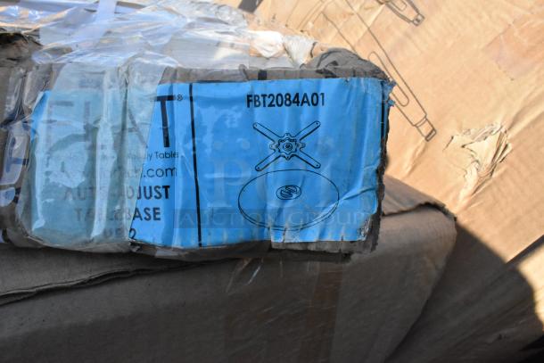 Cardboard box with blue label "FBT2084A01" containing scratched items like Cambro rack, Avantco salamander, Hatco lamp.