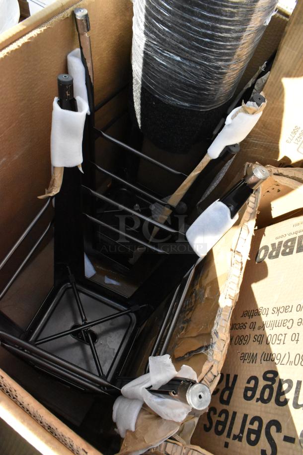 Box of new scratch and dent items including Cambro Dunnage Rack parts, wrapped for protection.
