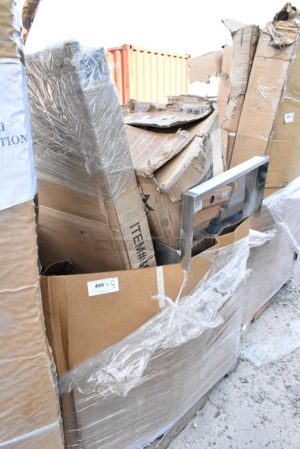 Damaged boxes containing mixed items, including a bar stool and flatware retriever, wrapped in plastic. Tags indicate item numbers.